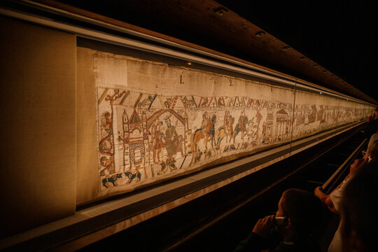 BAYEUX, FRANCE - AUGUST 25, 2022 Detail of the Bayeux Tapestry depicting the Norman invasion of England in the 11th Century