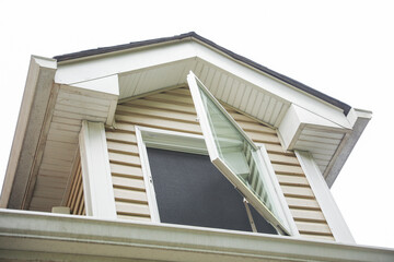 suburban house engulfed in a rising dollar sign symbolizes the meaning and symbolism of mortgage-driven inflation and the financial pressures of homeownership
