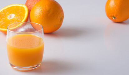 Orange juice and orange with white background
