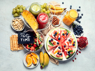 Summer fruits assorted on white background. Fresh raw food concept.