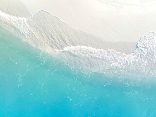 Aerial view with beach in wave of turquoise sea water shot, Top view of beautiful white sand background