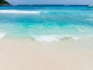 Summer tropical with Waves on the beach as a background