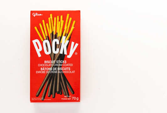 Calgary, Alberta, Canada. Jun 25, 2023. A box of biscuit sticks, chocolate cream coated Pocky, a Japanese sweet snack food produced by the Ezaki Glico food company.