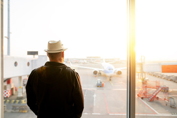 Fototapeta na wymiar people in airport waiting for departure, silhouette of man