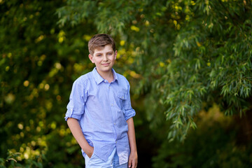 Handsome Teenager Boy Poses Outdoors, Exuding Confidence and Style in a Captivating Portrait. Happy...