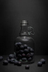 bottle of oil with blueberries