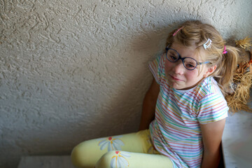 Lonely Upset Little Preschool Girl at Home. Sad Child Alone. Emotional Stress of Children, School, and Family Problems.
