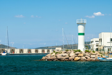 lighthouse and marina in summer