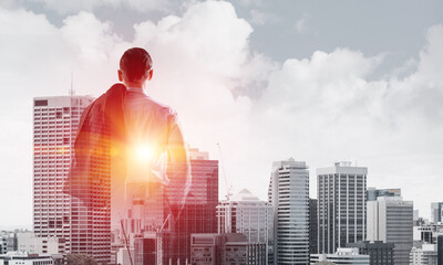 Concept of business success and control with confident boss against cityscape background