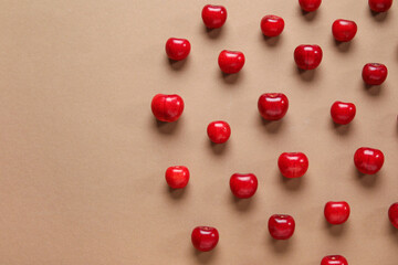 Many sweet cherries on brown background