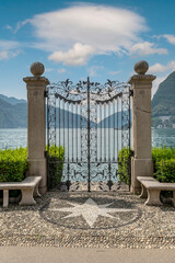 Ancient wrought iron gate overlooking Lake Lugano, Switzerland, in the Ciani park