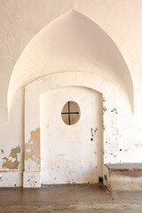 Arch over a circular window inside El Morro