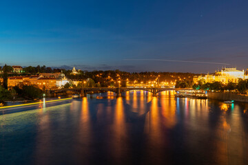 Fototapeta na wymiar night view of Prague with Manes Bridge and the Czech Philharmonic