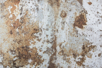 Rusty steel  plate with pealed white paint, weathered metal background