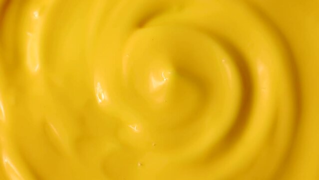 Bright Yellow Homemade Cheese Sauce Circle Rotation Close Up Top View