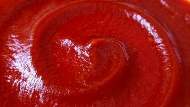 Red tomato ketchup texture circle rotation close up