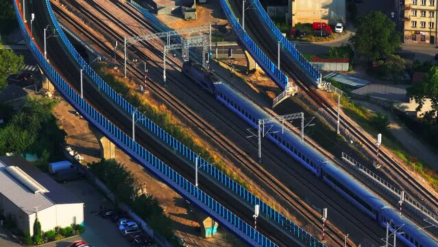 Passenger train on railway. Passenger train rides on the railroad. Train travel concept. Top view. 
