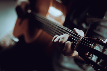 A man playing the guitar