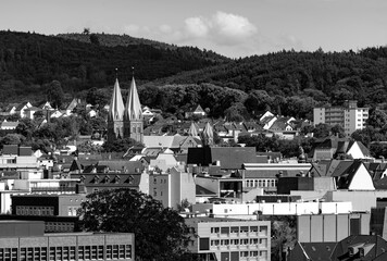 Panoramic view of Iserlohn city centre and old town in rural Sauerland with hills and forests in...