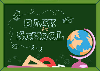 The blackboard "Back to school". Chalk, ruler, globe