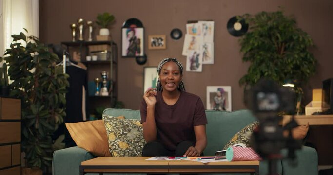 Afriican business entrepreneur, sharing business discussing tips for success, and empowering others to pursue their entrepreneurial dreams showcasing her colorful braids as a form of self-expression.