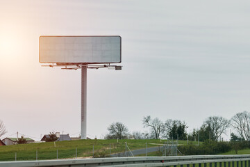 Blank billboard or road sign template on the highway. Empty billboard mockup for advertising located on the motorway