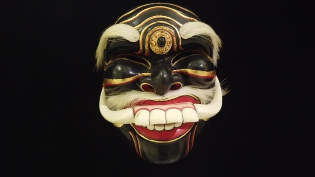 Old Man Ebony Skin Wooden Mask Character from Asia, Topeng Bali Indonesia, Black Background