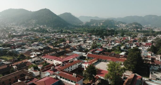 Residential Houses In The Town Of San Cristobal de las Casas With Mountain Landscape In Chiapas, Mexico. - aerial