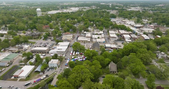 View from Above Of Downtown Siloam Springs During Dogwood Festival In Arkansas, USA. aerial pullback