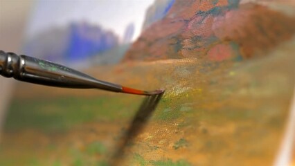Shallow depth of field of artists painting with brown green oil paint - Powered by Adobe