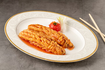 Squirrel fish on a white porcelain plate in a fine dining restaurant