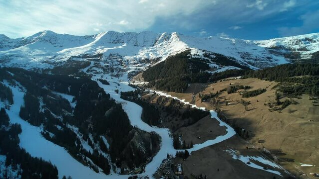 Drone view over Serfaus snowy mountains in Austria