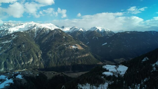 Drone view over Serfaus snowy mountains in Austria