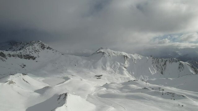 Drone view over Serfaus snowy mountains in Austria