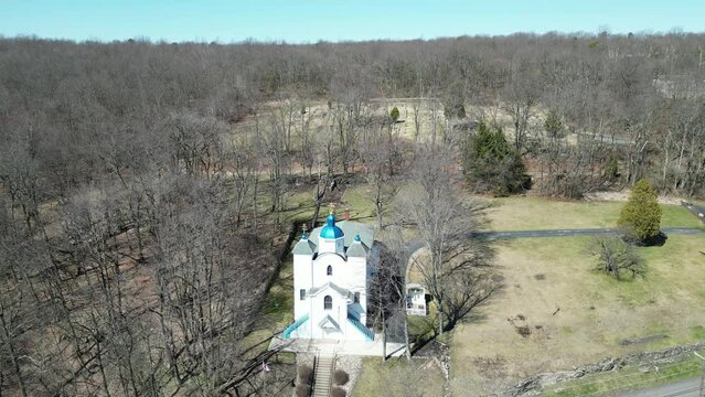 Drone view over the Centralia ghost town church surrounded by leafless trees