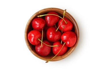 Cherries in wooden bowl on white background