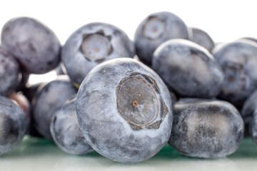 Several sweet blueberries, macro, isolated on white background.