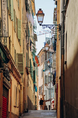 Fototapeta na wymiar Nice, France - 25 June 2023: Picturesque street in Old Nice