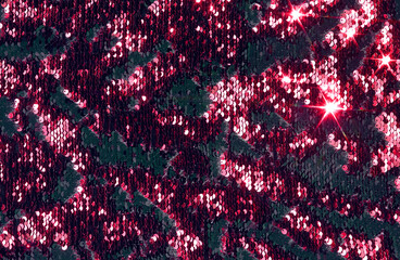 Pink, red background with sparkles, shiny fabric with sequins.