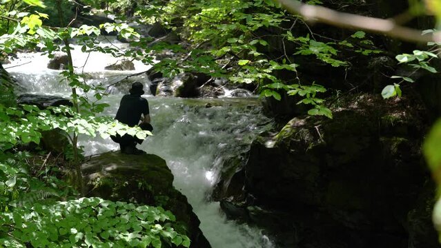 Pure mountain river, near the cascade - (4K)