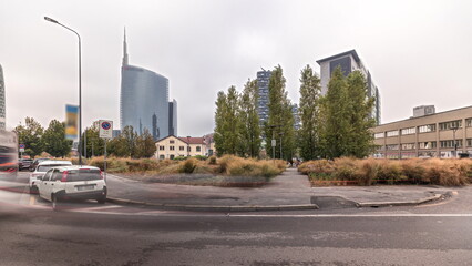 Fototapeta na wymiar Panorama showing skyscrapers and towers from park with green lawn timelapse in Milan