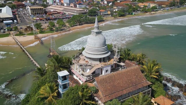 Aerial video of a Parewi Duwa Temple on the sea shore, Matara, Sri Lanka
