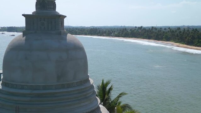Aerial video of a Parewi Duwa Temple on the sea shore, Matara, Sri Lanka