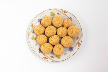 Plate of freshly baked cookie on the white background