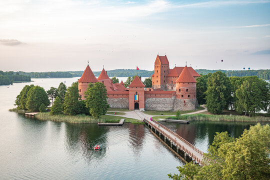 Hot Air Balloon Flight over Trakai. Medieval castle of Trakai, Vilnius, Lithuania, Eastern Europe, surrounded by beautiful islands, lakes, forests, wilderness, nature in summer at sunset, aerial view