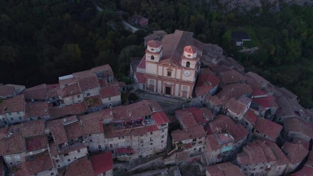 Artena town on hill top with church during sunrise, aerial
