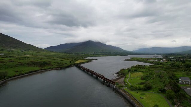 Valentia River Viaduct under cloudy dramatic sky in Cahersiveen, Ireland. Aerial