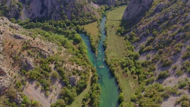 Panoramic shot of people kayaking in zrmanja river during daytime, aerial