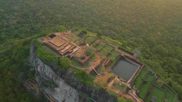 Aerial of the Lion Rock or Sigiriya mountain in Sri Lanka surrounded by the dense green forest