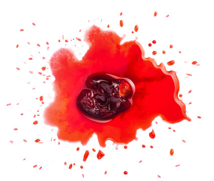 Squashed ripe sour cherry in the puddle of red juice isolated on white